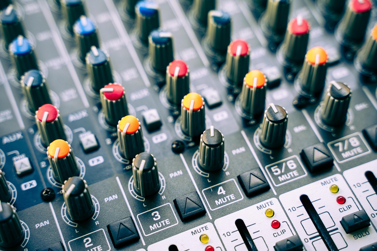 Professional audio mixing console and speakers at live event venue